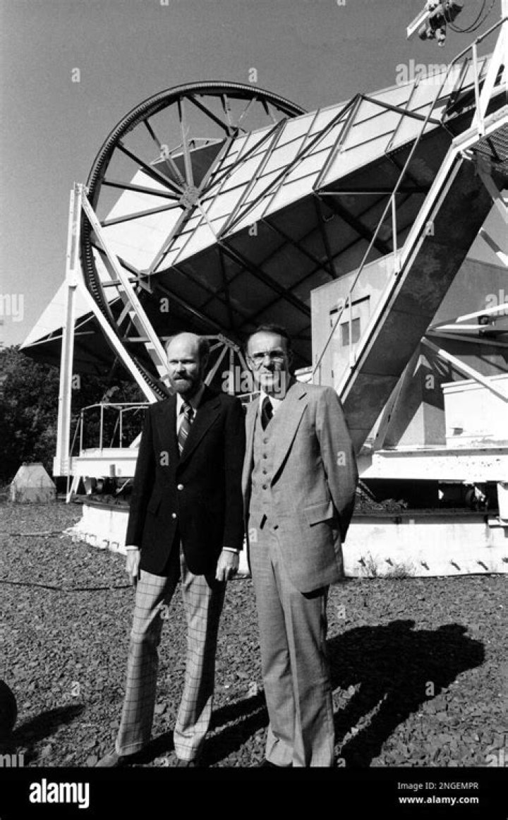 Why were Robert Wilson and Arno Penzias studying microwaves at Bell Laboratories?